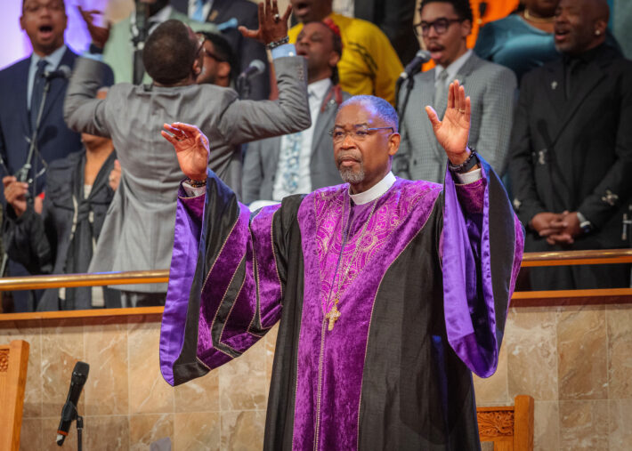 Bishop Seawright at Founders Day with hands ups